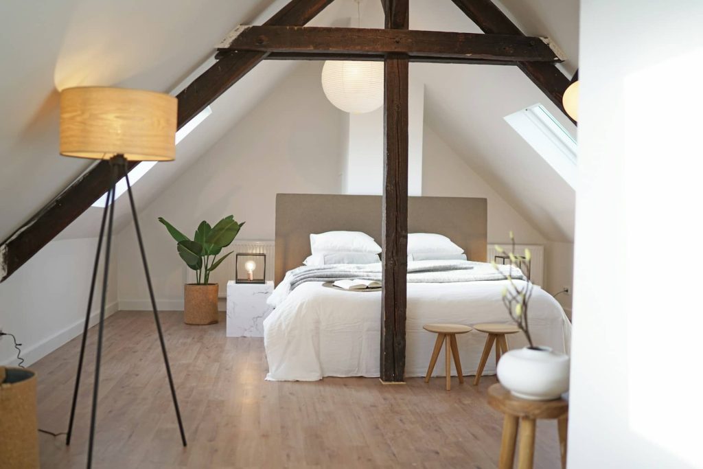 A bedroom loft conversion with wood finishes
