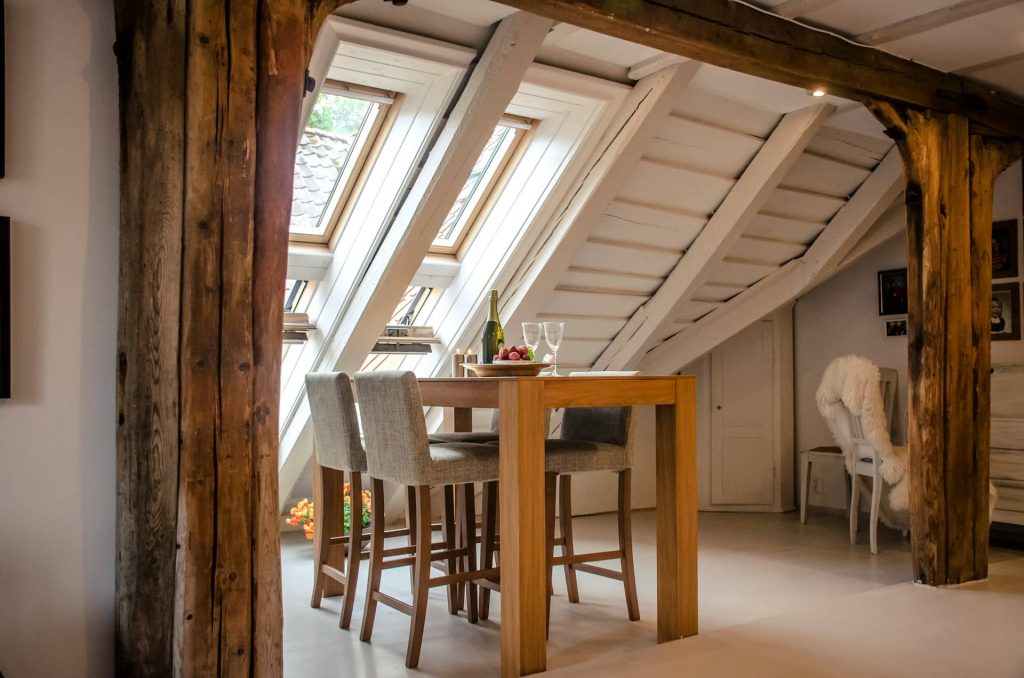 A completed loft conversion with new windows, storage, and a dining room